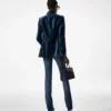 Pantaloni evazați din denim brut elastic Pantaloni evazați din denim brut elastic